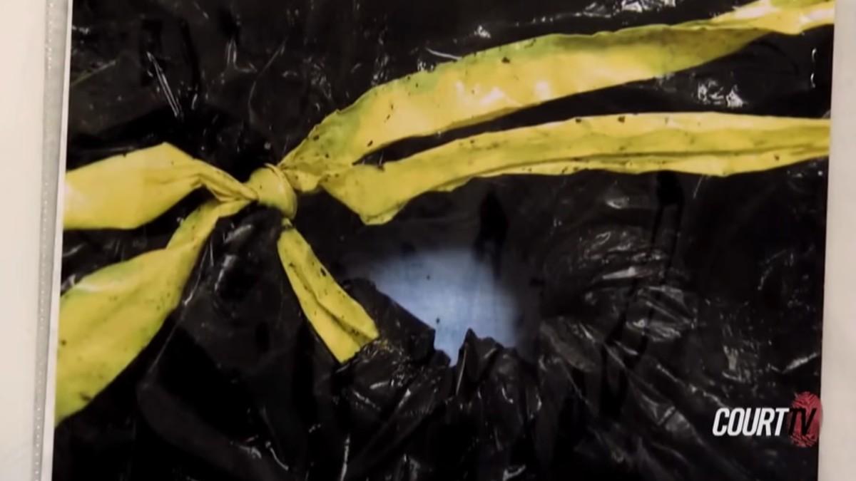 The toddler was found buried in a trash bag.