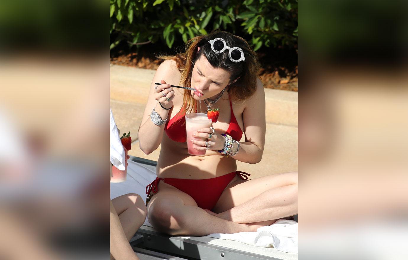 Bella Thorne Reveals Bushy Armpits While Washing Hair With Beer