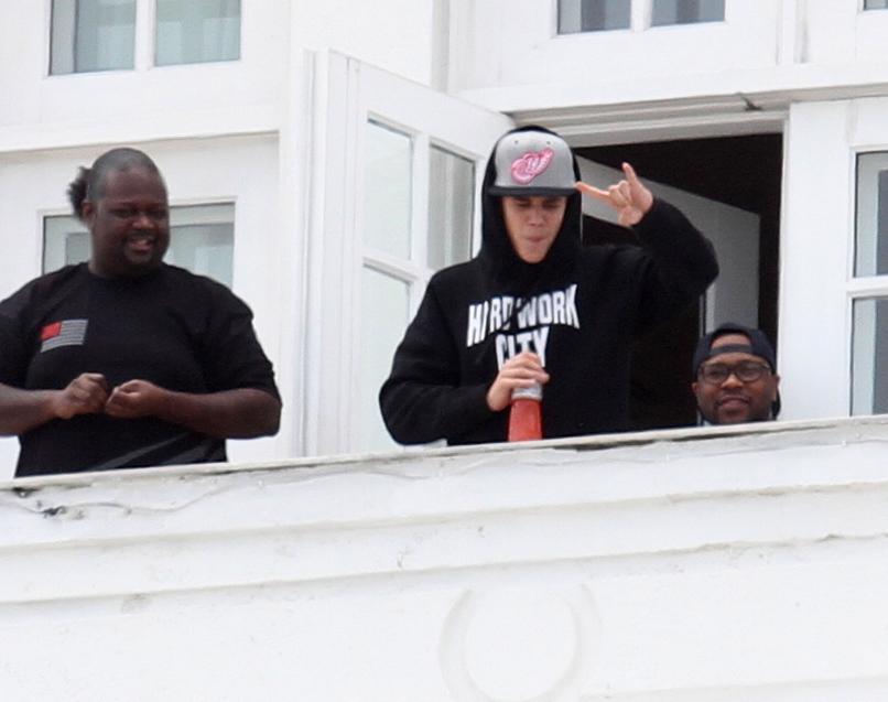 Justin Bieber greets fans from his balcony in Rio