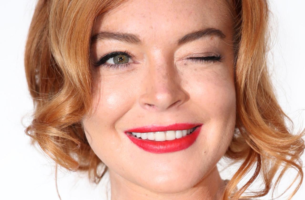 Lindsay Lohan gives the camera a wink in a closeup shot.