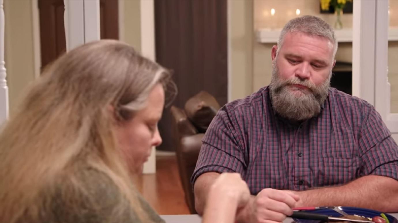 Paige and Bernie McGee sit at the dinner table.