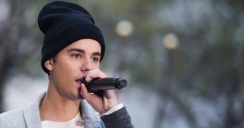 Justin Bieber sang one of his hits wearing a black knit beanie with a grey sweater covering a white T-shirt.