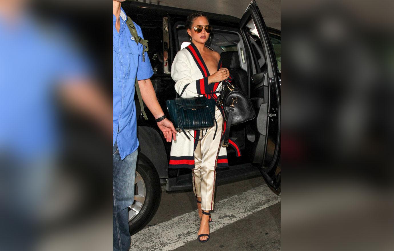 [pics] Chrissy Teigen Suffers Nip Slip In Gucci Robe