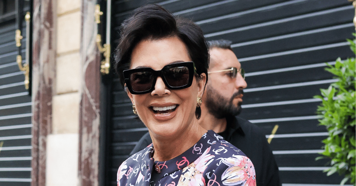 Photo of Kris Jenner smiling while wearing sunglasses.