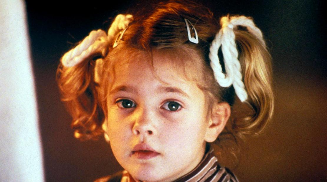 Drew Barrymore marveled at her alien friend in a scene from the classic film, E.T.