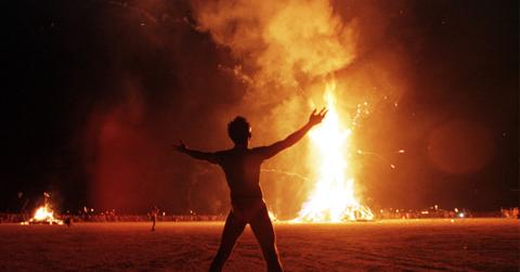 //tunned festival goers watch man run into flames at burning man pp