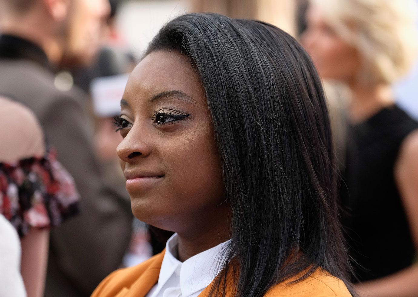 simone biles troubled childhood dad evicted sister car accident dwts