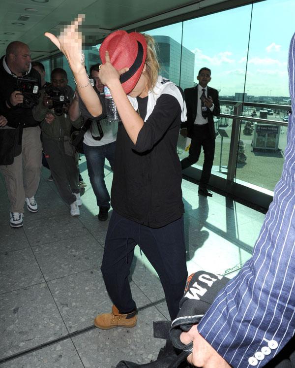 Cara Delevingne Goes Crazy At Heathrow Airport Chasing Photographers