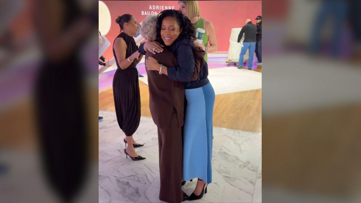 image of Sheinelle Jones embraced Adrienne Bailon-Houghton’s mother during a backstage moment on Today’s set.