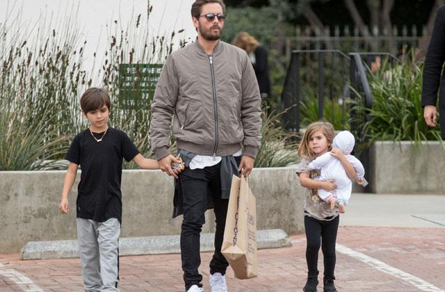 scott disick holding penelope