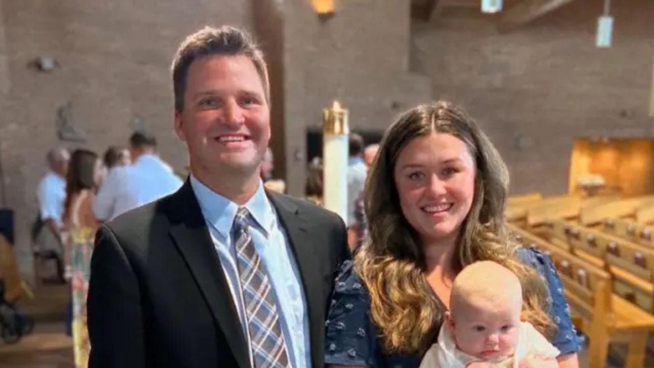 A photo of Corie Walsh, her husband, and her child