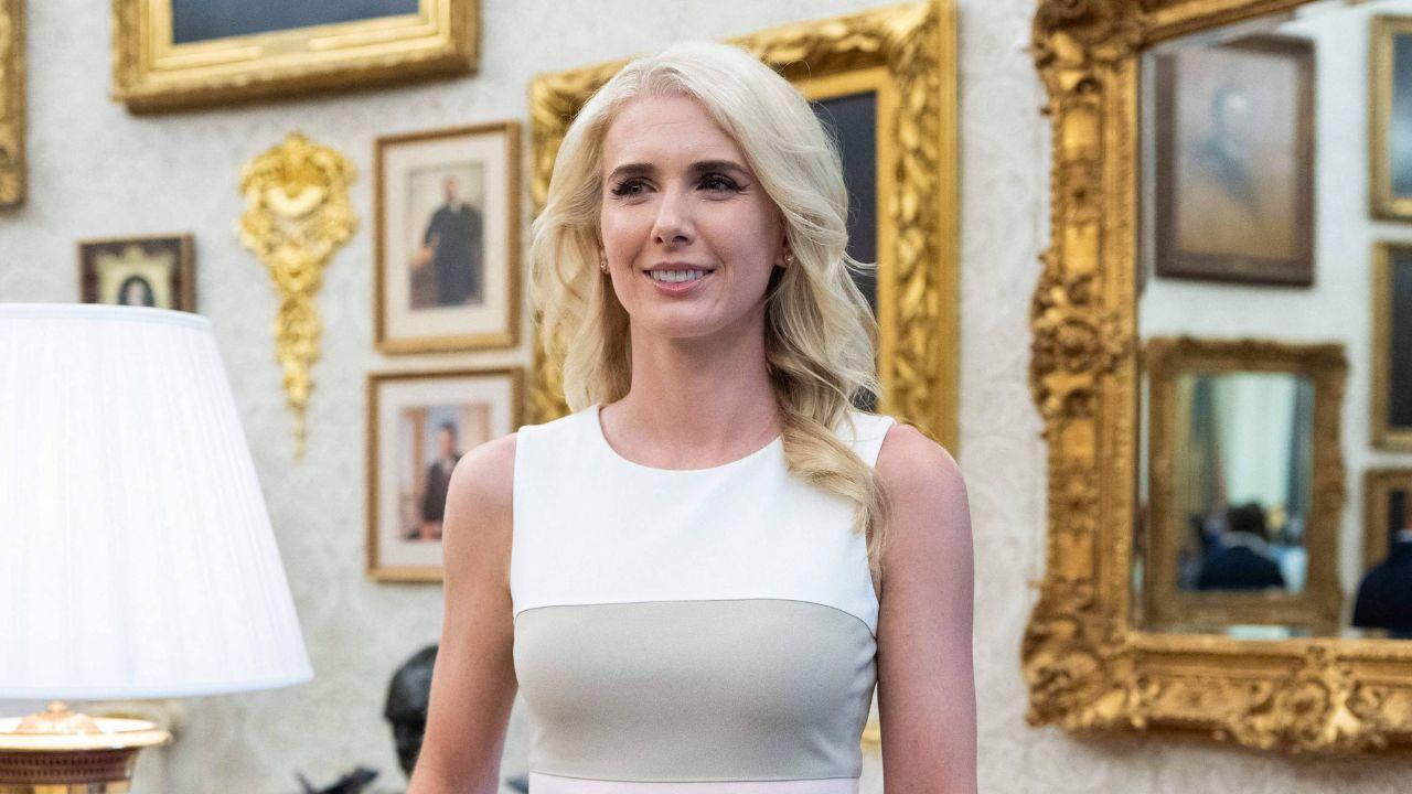 image of Natalie Harp was photographed carrying multiple phones and laptops while traveling with Donald Trump.