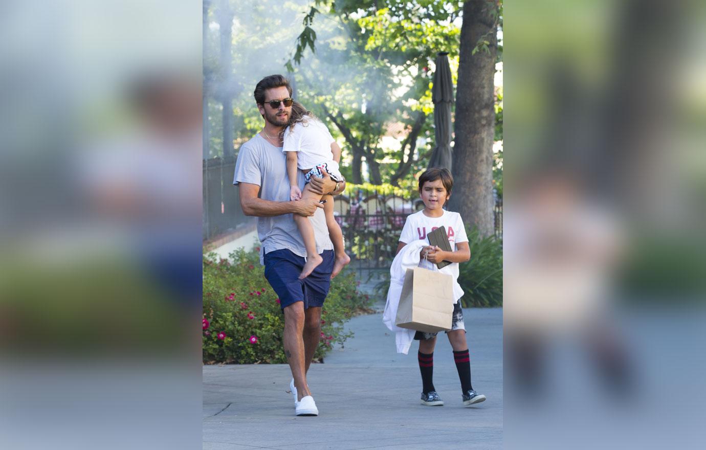 Scott disick carries sleepy penelope family dinner