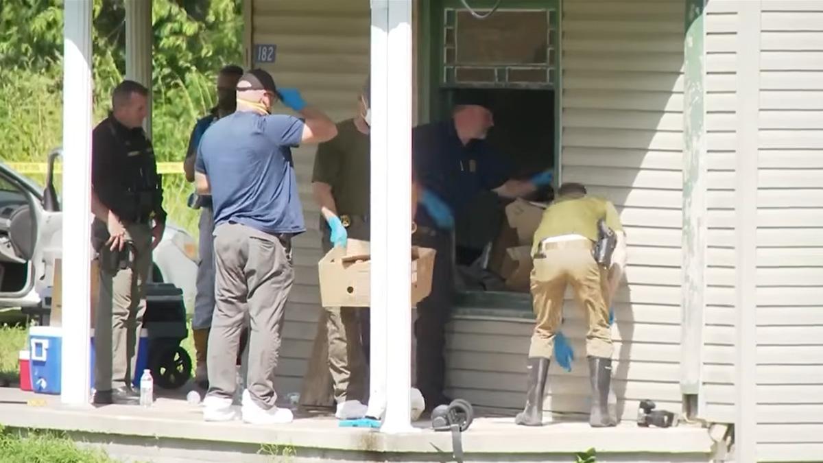 Cops said they had to wear masks to protect themselves from the smell of the home as they cleaned it out.