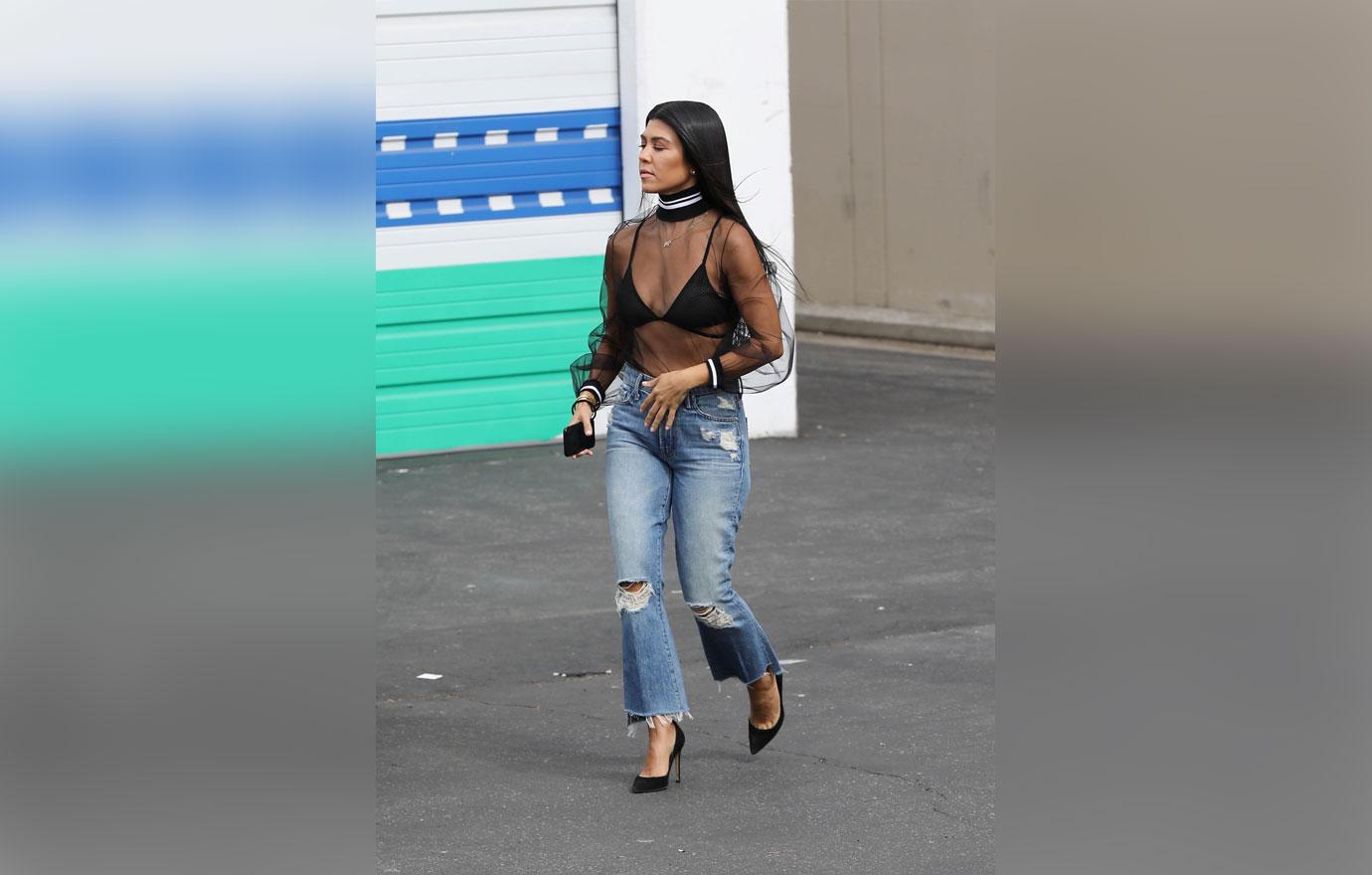 kourtney kardashian shows bra mesh top