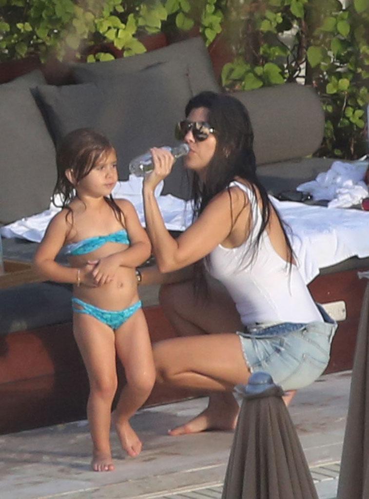 //kourtney kardashian swimsuit pool kids baby reign