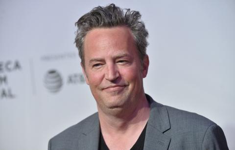 Matthew Perry looked much healthier at an event wearing a black V-neck T-shirt under a grey blazer.