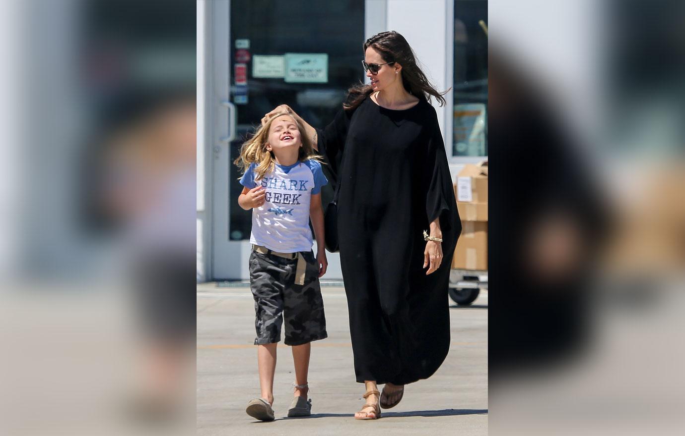 brad pitt angelina jolie daughter vivienne child abuse claims custody battle