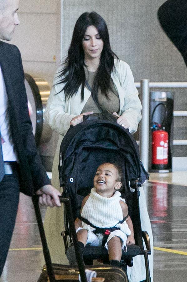 Kim Kardashian Kanye North West Photos -- Toddler Smiles As Family Arrives In Paris