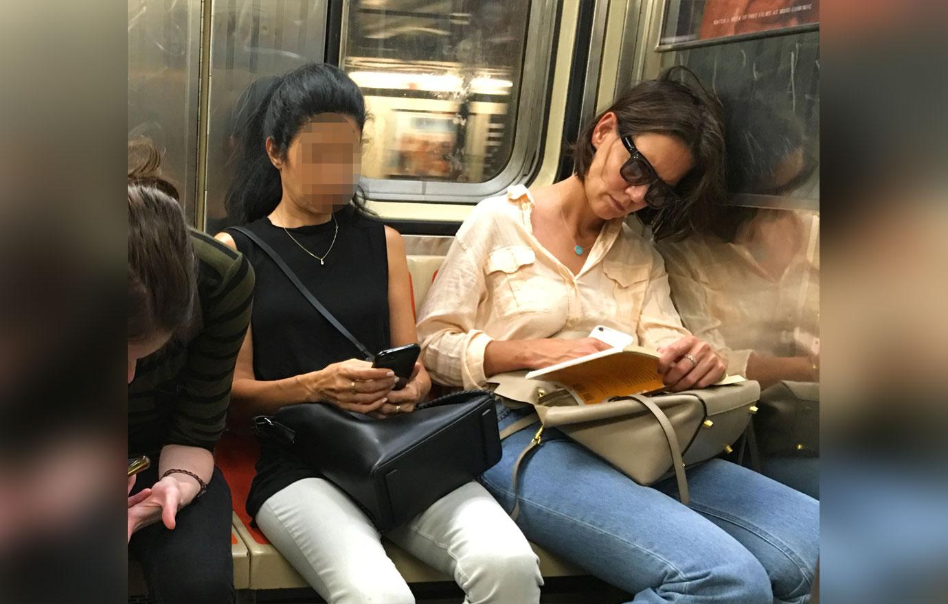 Katie Holmes Rides NYC Subway in Peach Top and Jeans and Sunglasses