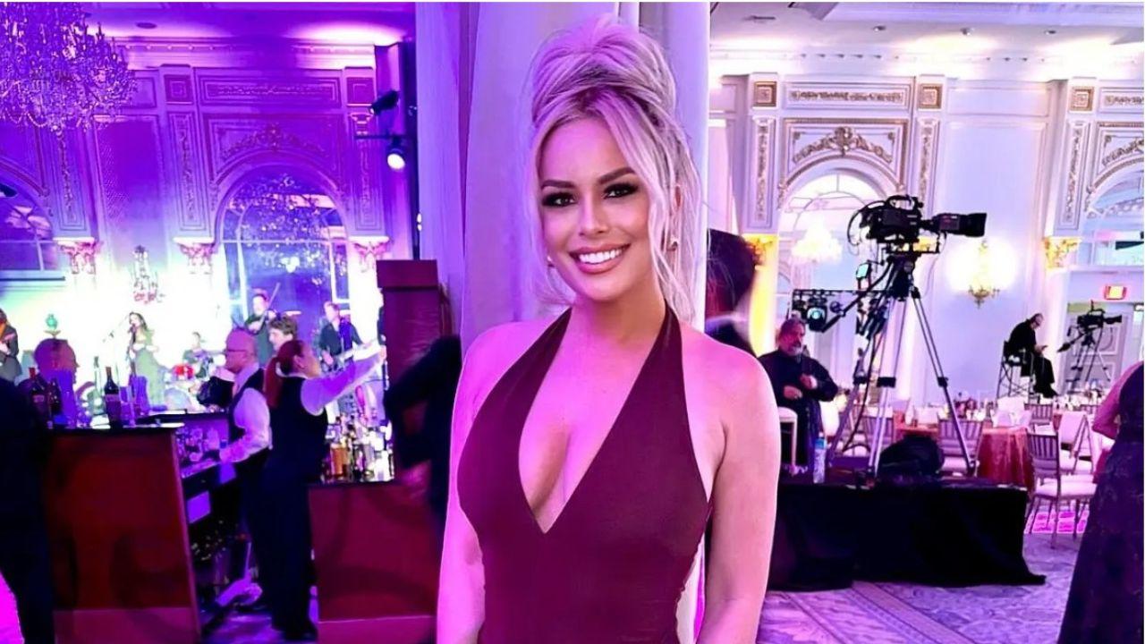 image of Britt McHenry was escorted out of Capital One Arena after video appeared to show her throwing a drink at fans chanting for her to leave.