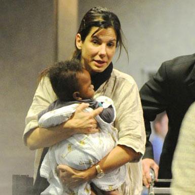 PHOTOS: Sandra Bullock & Baby Louis Back In L.A. To Attend Funeral