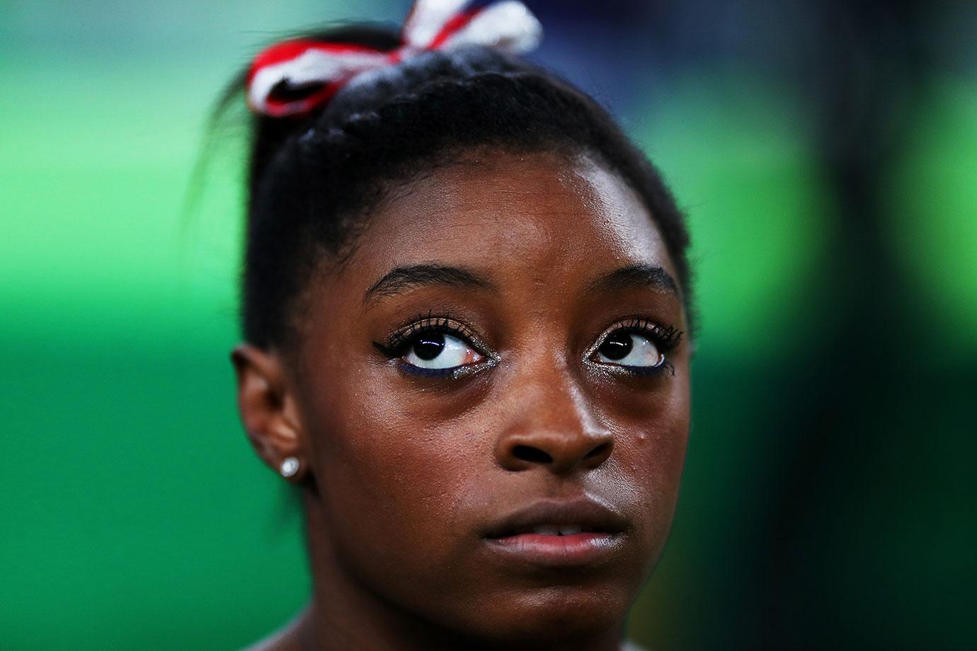 simone biles troubled childhood dad evicted sister car accident dwts