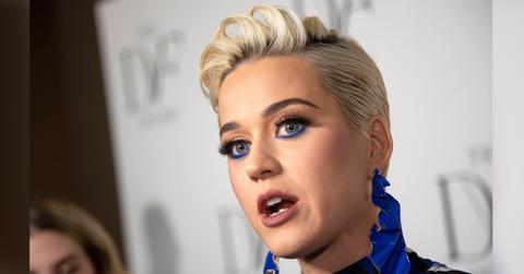 Katy Perry wears a purple and blue dress.