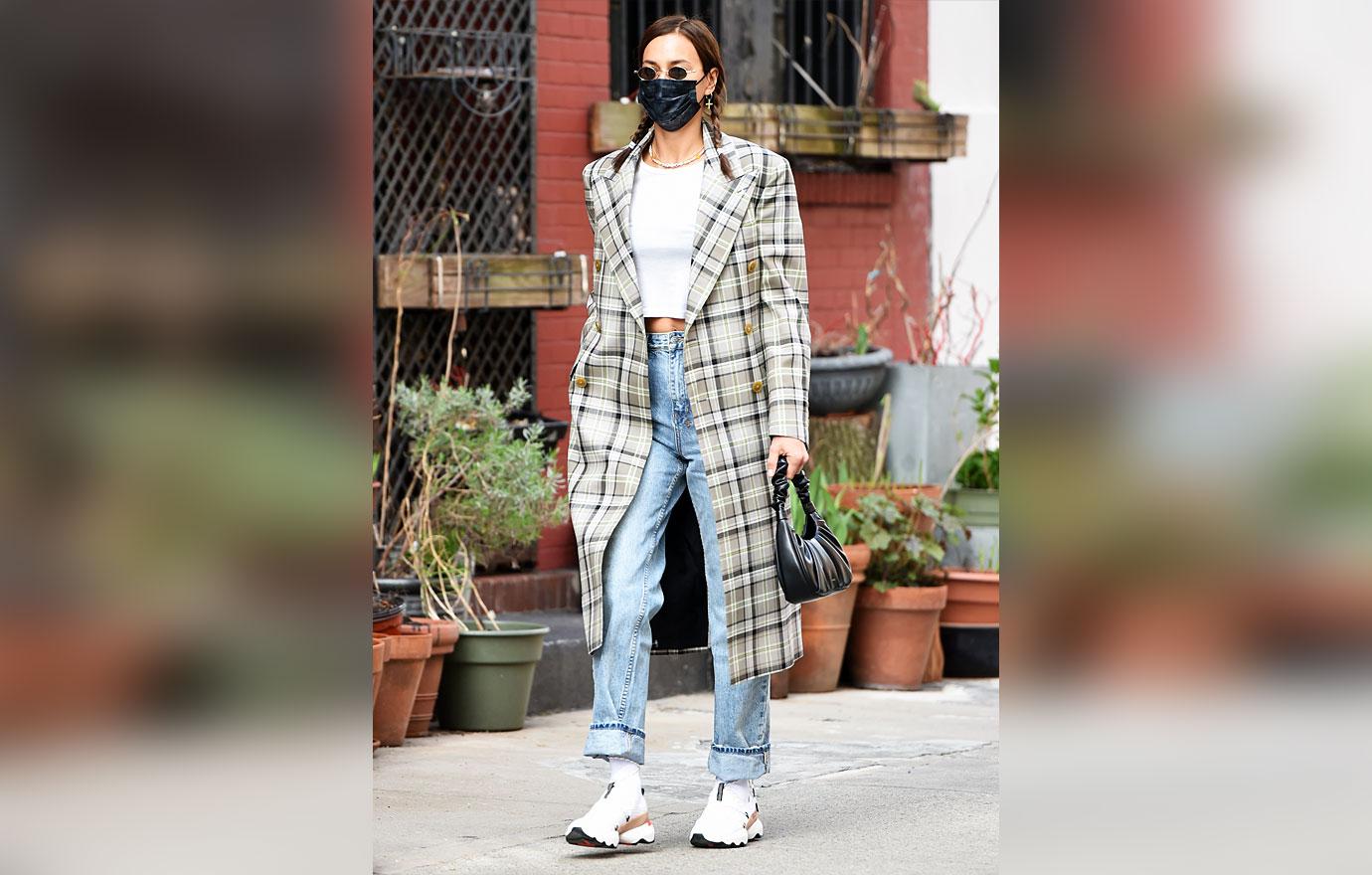 irina shayk wearing sorel kinetic impact lace sneakers