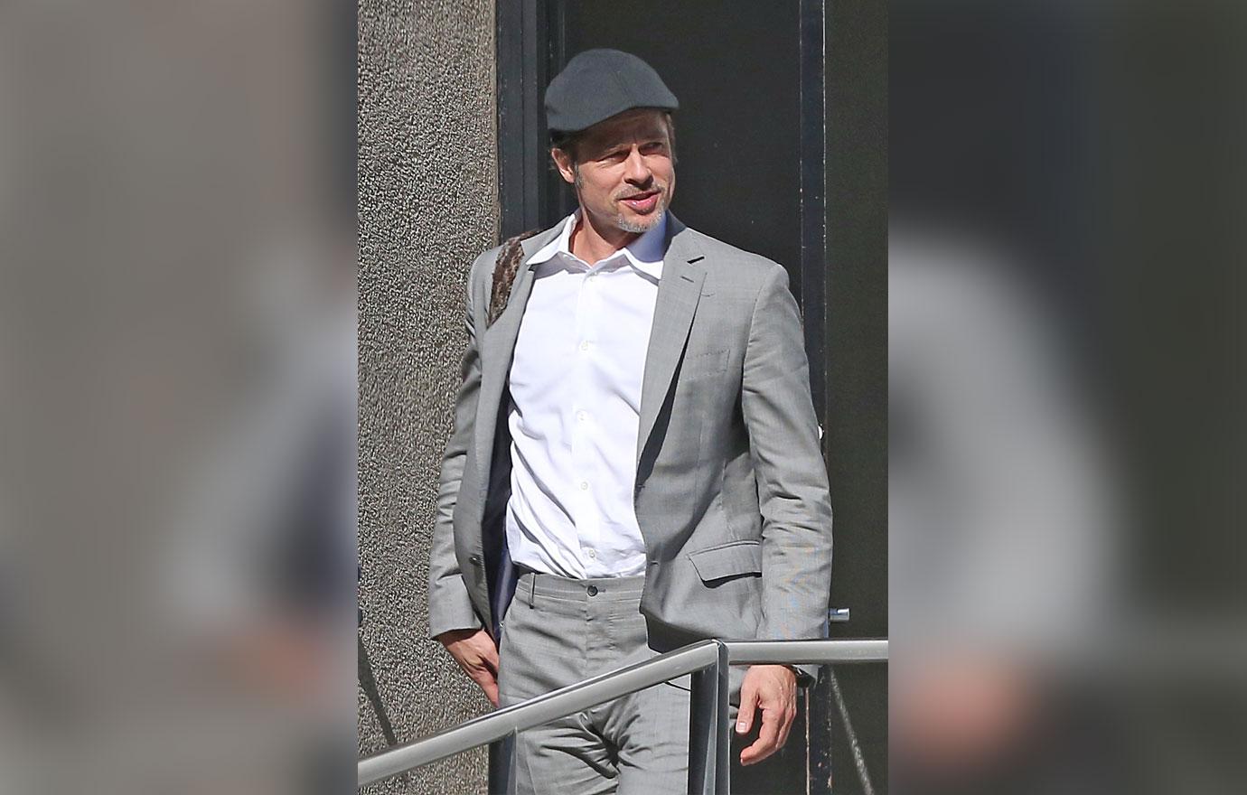 Brad Pitt Emerges Smiling From Office Building