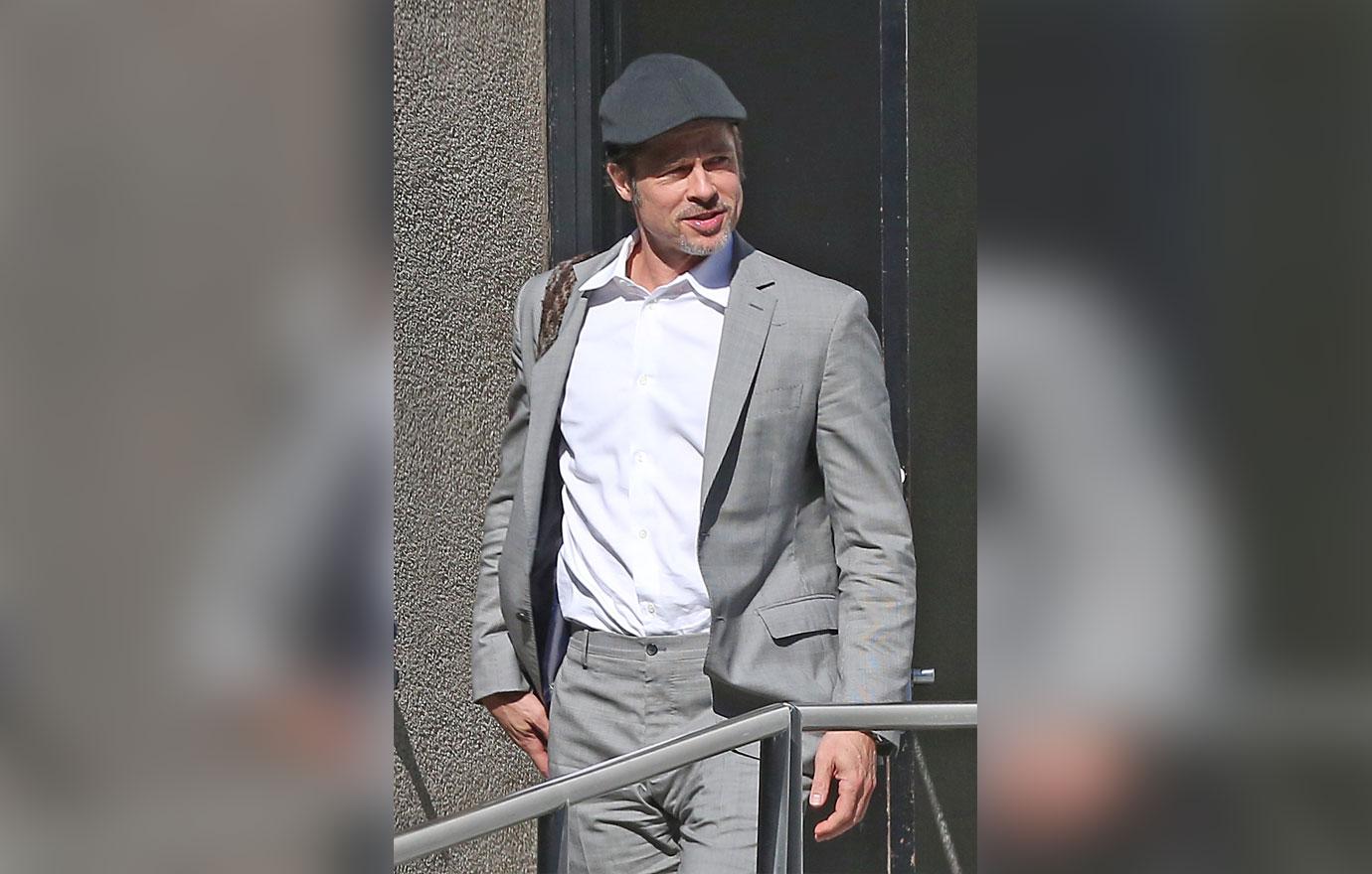 Brad Pitt Emerges Smiling From Office Building