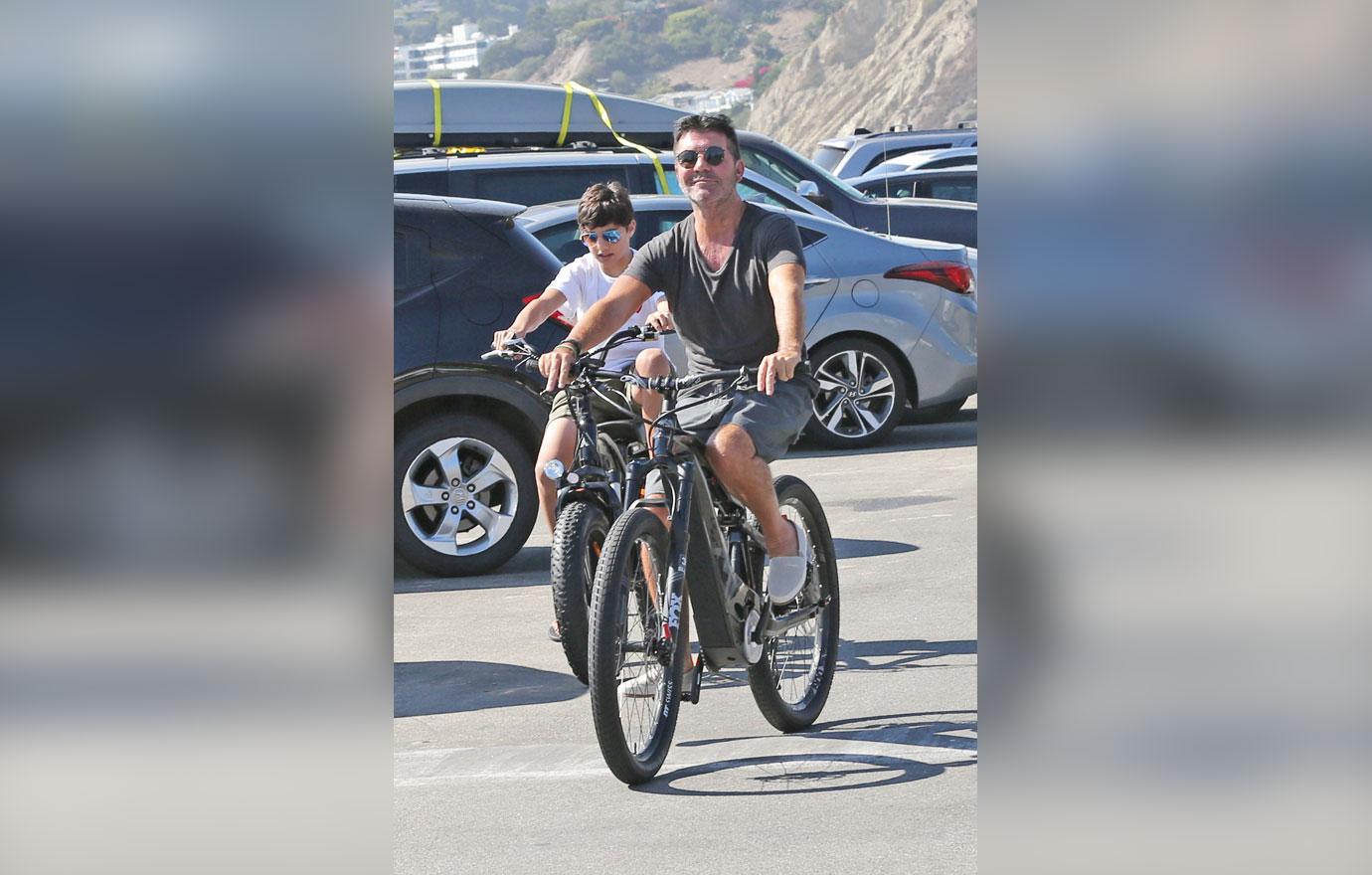 Simon Cowell Goes Bike Riding With His Family