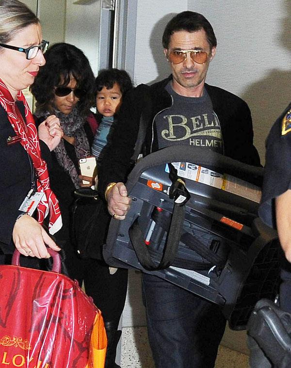 //olivier martinez pushes airport worker