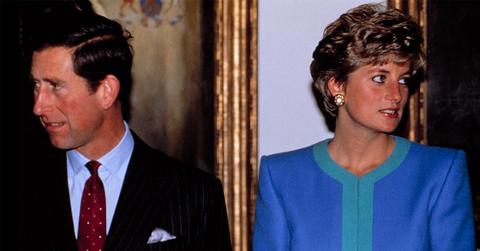 Prince Charles and Princess Diana looking in opposite directions of each other.