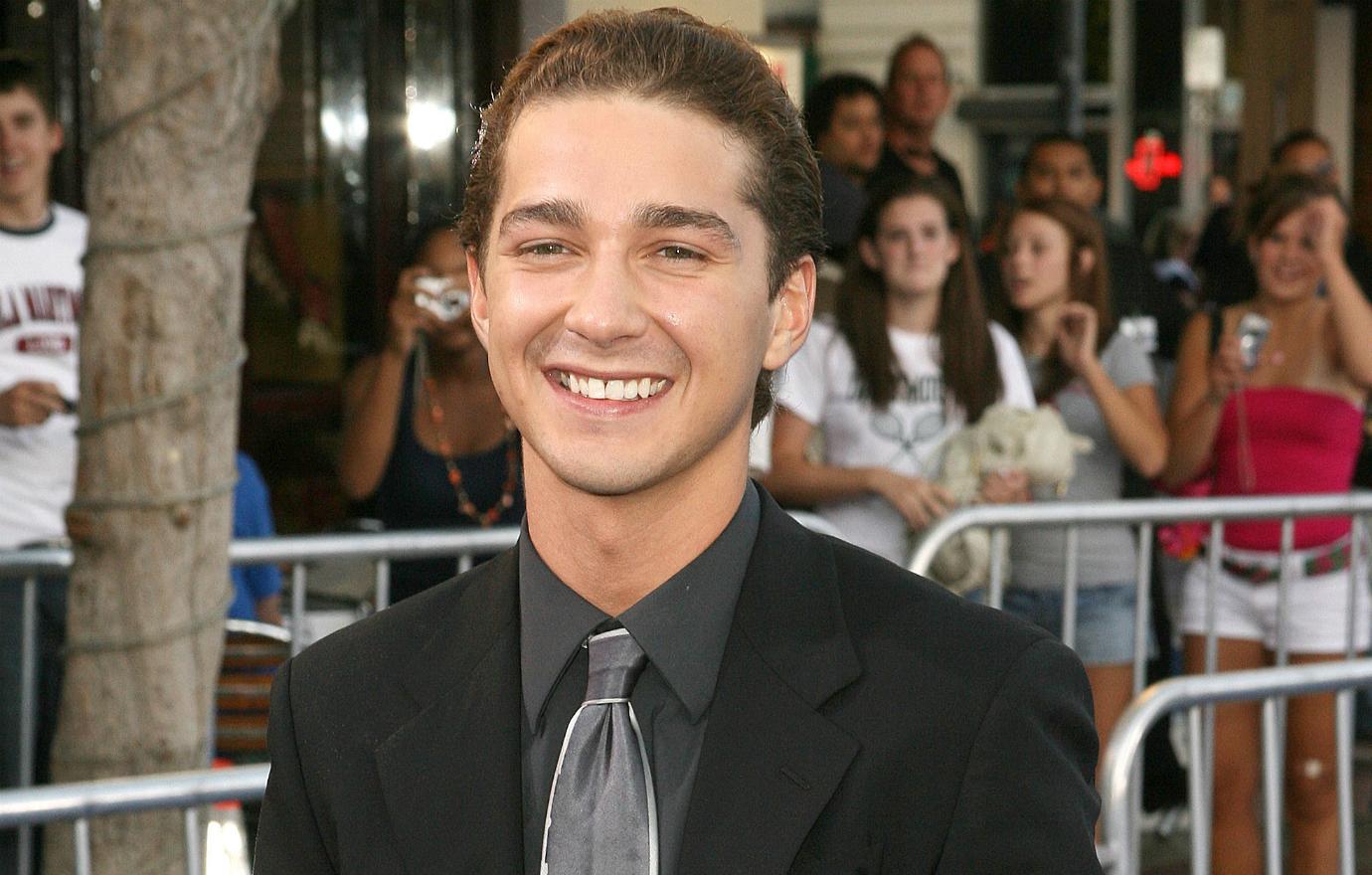 Shia LaBeouf wore a black suit with a grey dress shirt and tie at the premiere of his first Transformers movie.