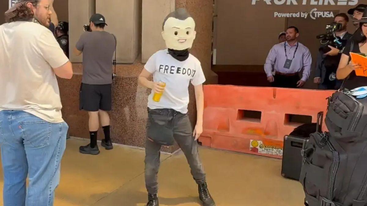 A photo of a Turning Point USA protestor dressed as Charlie Kirk