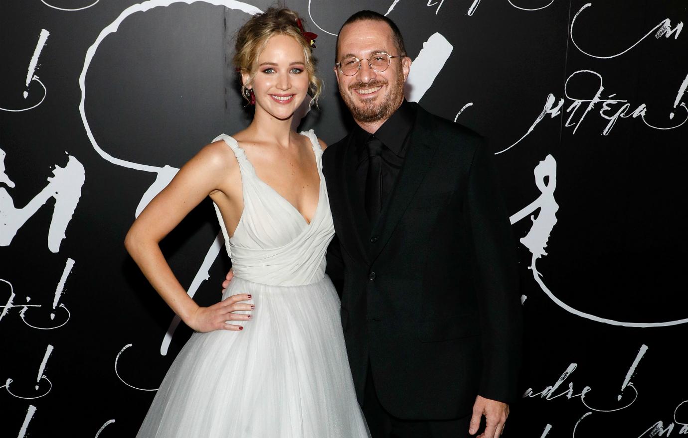 Jennifer Lawrence wore a black sundress and sun hat walking in Rome with her fiancé, Cooke Maroney, who was dressed in a T-shirt and casual slacks.