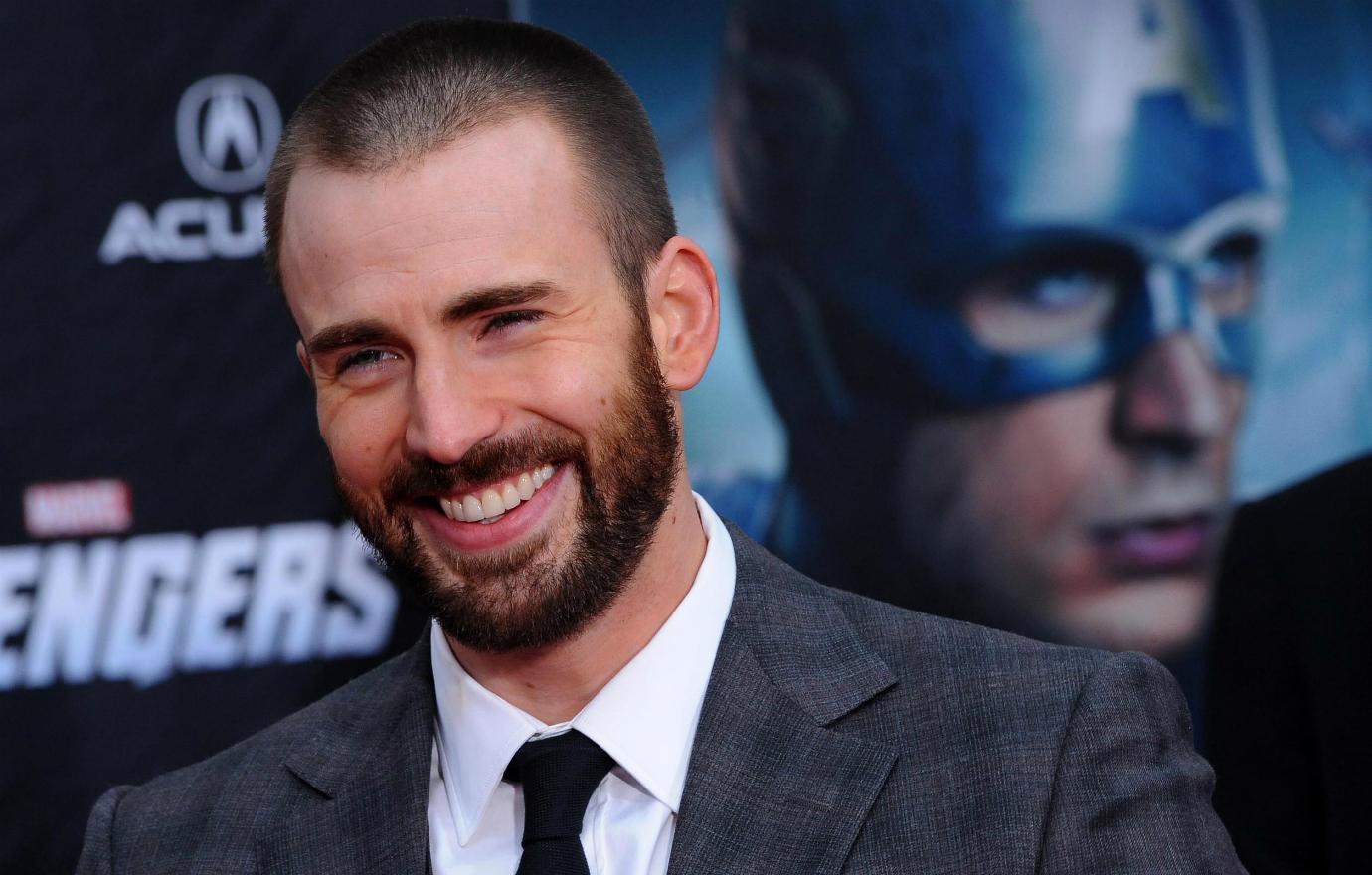 Chris Evans was all smiles in a grey suit at the Avengers premiere.