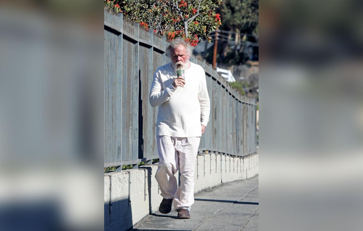 //Nick Nolte Climbs Fence Photos