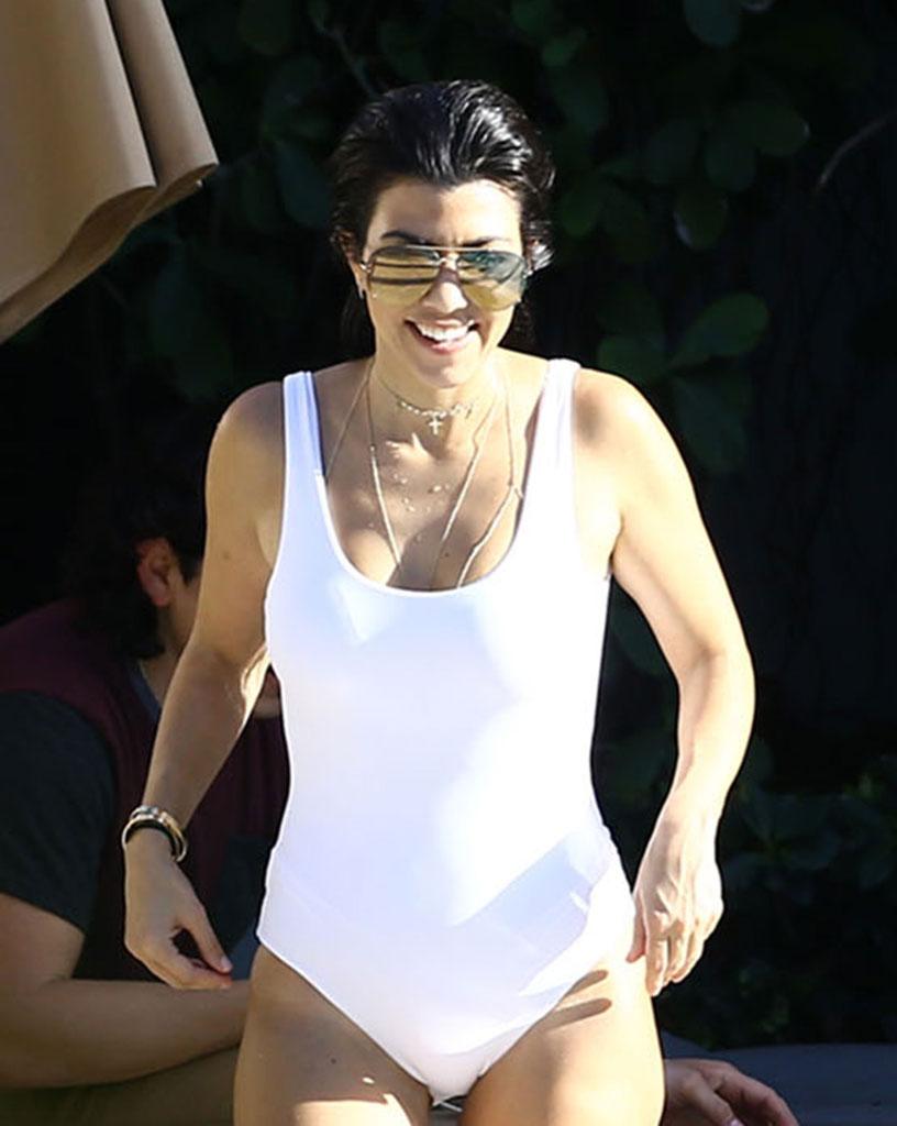 //kourtney kardashian swimsuit pool kids baby reign