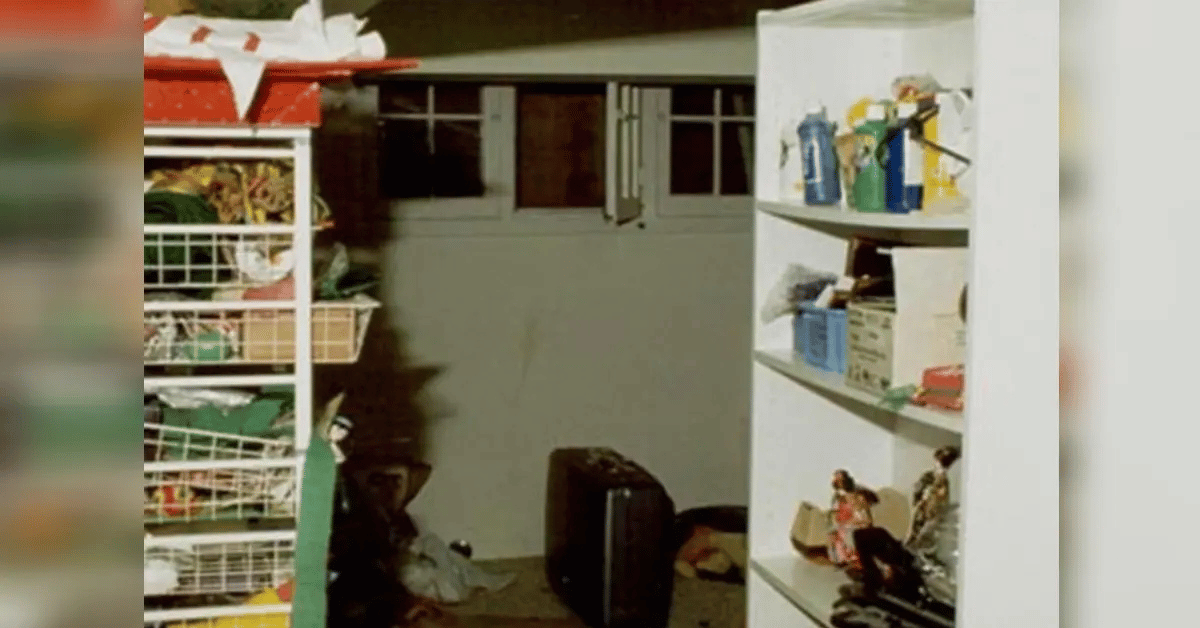 Photo of an open window and suitcase below in the Ramsey basement