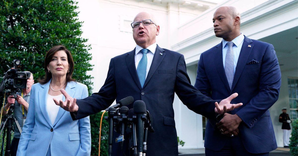 Tim Walz pictured at his podium giving a speech