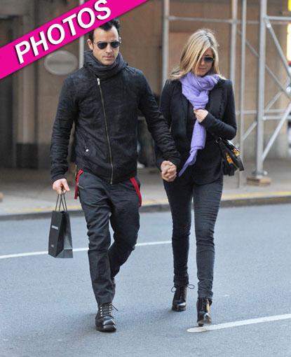 Jennifer Aniston and Justin Theroux in matching black at Louis