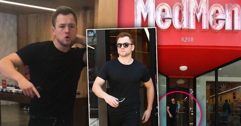 Taron Egerton Wearing Black T-Shirt and Black Jeans Caught In Pot Joint