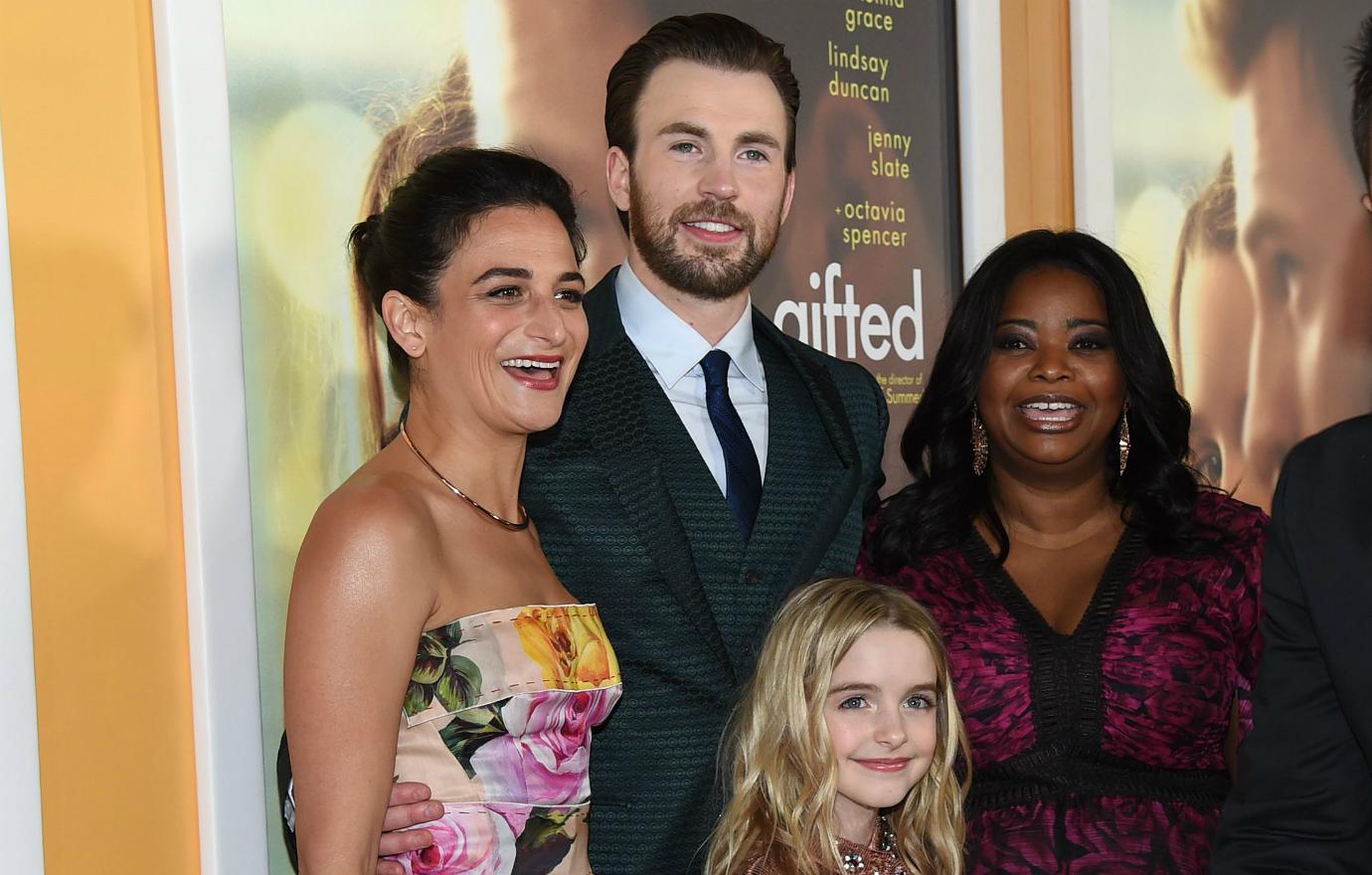 Jenny Slate, in a floral gown, stood with Gifted co-stars Chris Evans (in a suit), Octavia Spencer (in a maroon and black dress) and Mckenna Grace (in a pink, sparkly dress) at the Gifted premiere.