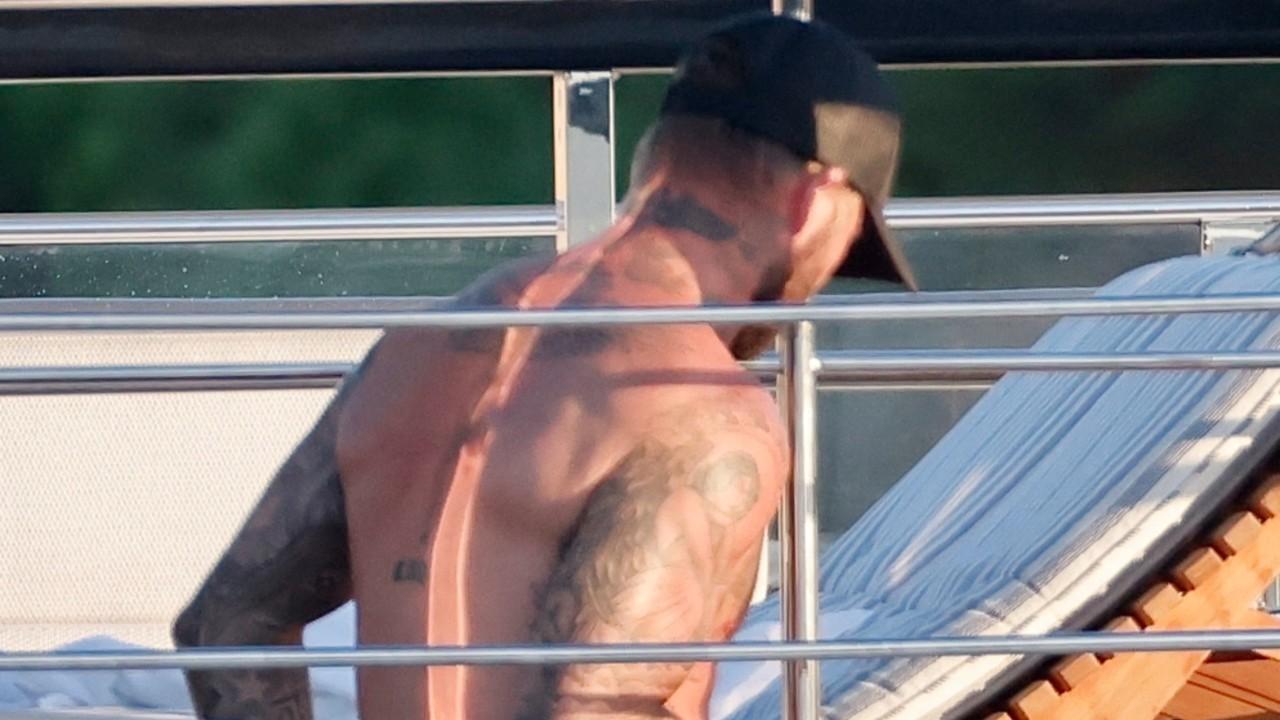David Beckham sported a light blue pair of swim trunks on the outing.