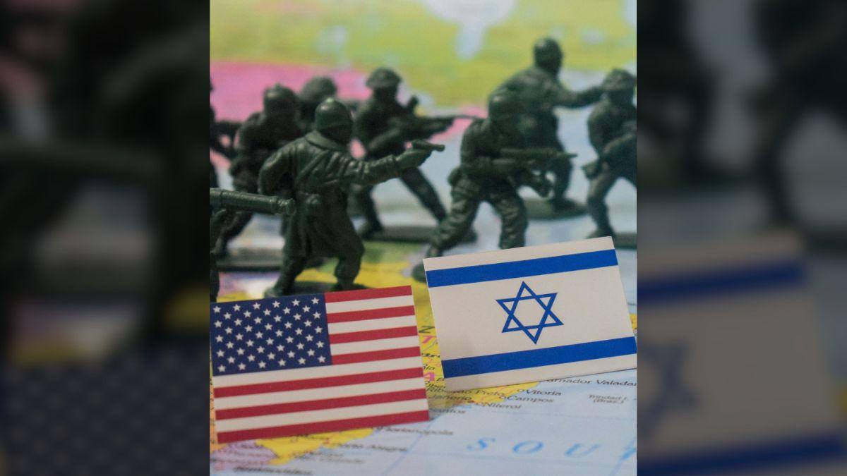 Photo of miniature army figures with USA and Israel flags on a world map signifying military strategy