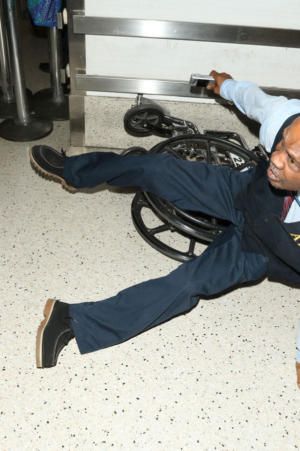 //olivier martinez pushes airport worker