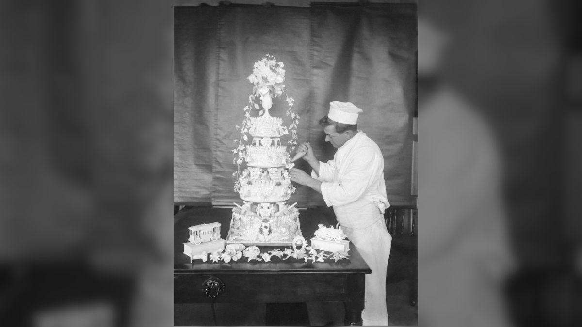 Photo of a baker creating a wedding cake