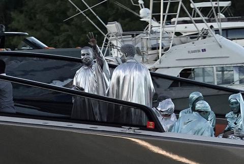 Kanye West Wears Silver Body Paint & Robe For Miami Opera